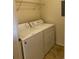 This laundry room features a washer and dryer at 5924 Brickleberry Ln # 101, Zephyrhills, FL 33541