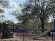 Community playground featuring climbing structures, a slide, and a gazebo at 5924 Brickleberry Ln # 101, Zephyrhills, FL 33541