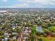 Aerial view showcases the home's proximity to tennis courts, a sports field, and a vibrant community at 605 12Th N Ave, St Petersburg, FL 33701