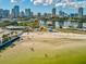 Panoramic aerial shot of a sandy beach and water in St. Petersburg, Florida, with the city in the background at 605 12Th N Ave, St Petersburg, FL 33701