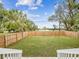 A big, grassy backyard with a wooden fence at 605 12Th N Ave, St Petersburg, FL 33701