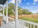 Spacious backyard view from covered porch with wooden fence and lush greenery at 605 12Th N Ave, St Petersburg, FL 33701