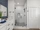 Modern bathroom featuring a glass-enclosed shower with subway tile, sleek vanity, and stylish fixtures at 605 12Th N Ave, St Petersburg, FL 33701