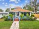 Attractive home with a screened porch, manicured lawn, and colorful landscaping, ideal for relaxing outdoors at 605 12Th N Ave, St Petersburg, FL 33701