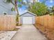 The detached garage with a long driveway provides ample parking and storage space for vehicles and outdoor equipment at 605 12Th N Ave, St Petersburg, FL 33701