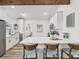 Modern kitchen showcases white cabinets, stainless steel appliances, and a breakfast bar with counter seating at 605 12Th N Ave, St Petersburg, FL 33701