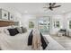 Main bedroom with wood floors, a ceiling fan, and sliding doors to the outdoor deck at 605 12Th N Ave, St Petersburg, FL 33701