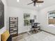 Bright home office featuring ceiling fan, desk, and view of backyard at 605 12Th N Ave, St Petersburg, FL 33701