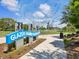 View of Glazer Gathering Playground with unique overhead shade structure and walking path at 605 12Th N Ave, St Petersburg, FL 33701