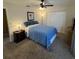 Cozy bedroom featuring carpet, ceiling fan, and standard closet at 7044 Everest St, Spring Hill, FL 34606