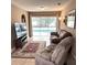 Inviting living room with a view of the pool through sliding glass doors, creating a relaxing atmosphere at 7044 Everest St, Spring Hill, FL 34606