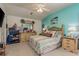 Bright bedroom with a ceiling fan, a large bed, and matching dressers at 7536 Roland Ct, New Port Richey, FL 34654