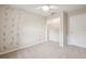 Bedroom features neutral carpeting, ceiling fan, and a closet for storage at 759 Timuquana Ln, Palm Harbor, FL 34683