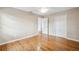 Neutral bedroom features a ceiling fan, wood floors, and bright natural light at 759 Timuquana Ln, Palm Harbor, FL 34683