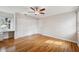 This bedroom features hardwood floors, a fan, and a window seating area at 759 Timuquana Ln, Palm Harbor, FL 34683