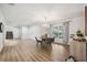 Dining area with wood-look flooring, a round table with chairs, and a staircase leading to a second story at 759 Timuquana Ln, Palm Harbor, FL 34683