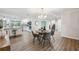 Bright dining area features modern chandelier and flows into the updated kitchen at 759 Timuquana Ln, Palm Harbor, FL 34683