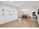 Bright foyer showcasing wood-look floors, a dining area, and a glimpse into the living space with a fireplace at 759 Timuquana Ln, Palm Harbor, FL 34683