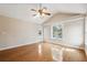 Spacious living room features wood floors, vaulted ceilings, and multiple windows at 759 Timuquana Ln, Palm Harbor, FL 34683