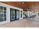 Wide-angle view of covered patio and outdoor seating near pool at 759 Timuquana Ln, Palm Harbor, FL 34683