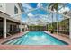 Enjoy a refreshing swim in this screened pool featuring brick trim and steps for easy access at 759 Timuquana Ln, Palm Harbor, FL 34683