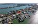 Aerial view of waterfront homes with docks, showcasing a charming neighborhood near the water at 809 59Th Ave, St Pete Beach, FL 33706