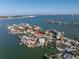 Stunning aerial view of waterfront properties with private docks, offering serene coastal living at 809 59Th Ave, St Pete Beach, FL 33706