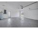 Clean, bright garage featuring neutral walls, gray flooring, and a door to the exterior at 809 59Th Ave, St Pete Beach, FL 33706