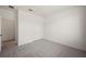 Clean bedroom with neutral carpet, white walls, and a closet offering storage at 8363 Sandbank Pl, Englewood, FL 34224