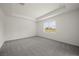 A bright bedroom with a trey ceiling, carpet and natural light from the window at 8363 Sandbank Pl, Englewood, FL 34224