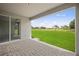 Covered patio with brick pavers and a backyard view at 8363 Sandbank Pl, Englewood, FL 34224