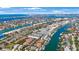 Gorgeous aerial view of waterfront properties, showcasing boat docks, serene waterways, and stunning coastal scenery at 903 Pinellas Bayway S # 307, Tierra Verde, FL 33715