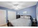 This bedroom features a closet, ceiling fan, and serene blue walls at 903 Pinellas Bayway S # 307, Tierra Verde, FL 33715