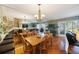 Dining room area adjacent to the living area offers plentiful seating and light at 903 Pinellas Bayway S # 307, Tierra Verde, FL 33715