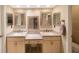 Beautiful bathroom features dual vanity sinks, decorative mirrors, and seated makeup area at 903 Pinellas Bayway S # 307, Tierra Verde, FL 33715