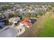 The aerial view shows the house sits on a large lot in a developed community with mature trees at 9234 Duffer Ct, Hudson, FL 34667