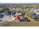 Expansive aerial view of a home featuring a screened pool and neighborhood in a suburban setting at 9234 Duffer Ct, Hudson, FL 34667