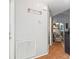 Hallway with laminate floors, leading to the rooms, and decor on the wall at 9234 Duffer Ct, Hudson, FL 34667