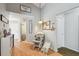 Hallway features laminate floors, rocking chair, and decor at 9234 Duffer Ct, Hudson, FL 34667