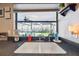 Kitchen sink area featuring a large window overlooking the patio, set against the backdrop of lush green foliage at 9234 Duffer Ct, Hudson, FL 34667