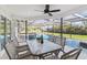 Inviting covered patio with dining and lounging area overlooking a refreshing in-ground swimming pool at 9234 Duffer Ct, Hudson, FL 34667