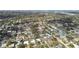 Wide aerial shot showing many single-Gathering homes nestled among lush trees in a suburban neighborhood at 969 Britton St, Largo, FL 33770