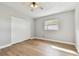 Bedroom featuring laminate flooring, neutral walls, and a closet at 969 Britton St, Largo, FL 33770