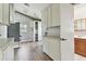 Utility Room featuring laminate floors, white storage cabinets and laundry hookups at 969 Britton St, Largo, FL 33770