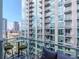 Balcony view showcasing city skyline, tall building and outdoor seating area at 111 N 12Th St # 1820, Tampa, FL 33602