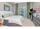 Calm bedroom with a large window and city views, complemented by modern decor at 111 N 12Th St # 1820, Tampa, FL 33602