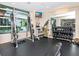 Well-equipped gym with weightlifting machines, free weights, mirrors, and a wall-mounted TV at 111 N 12Th St # 1820, Tampa, FL 33602