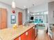 Stylish kitchen featuring a breakfast bar, modern cabinetry, and open living space at 111 N 12Th St # 1820, Tampa, FL 33602