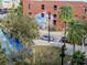 A street view of local buildings and colorful outdoor murals in a park-like setting at 111 N 12Th St # 1820, Tampa, FL 33602