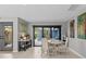 Cozy dining room with sliding glass doors and stylish decor at 114 12Th St, Belleair Beach, FL 33786